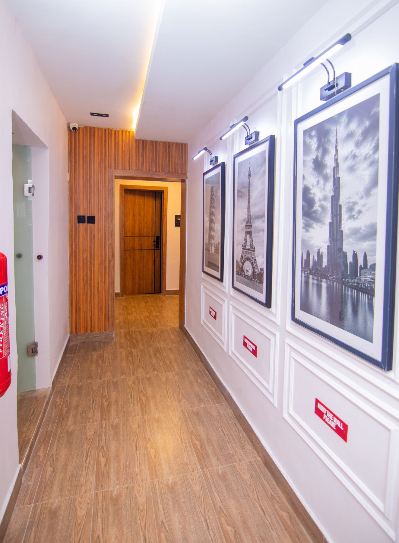 Emperor Suites furnished walkway and wall art